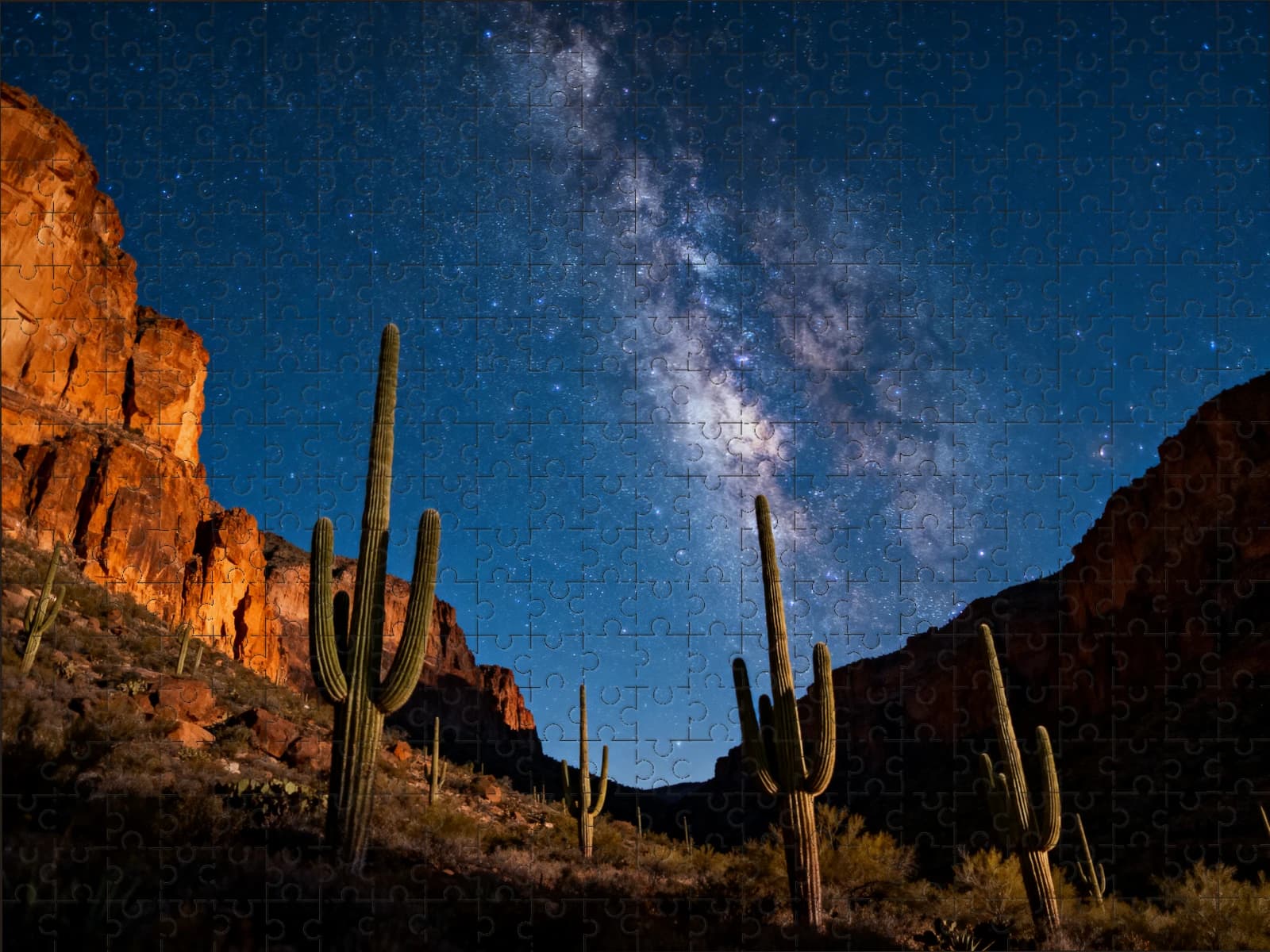 A finished puzzle of a desert canyon under the Milky Way
